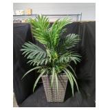 Fake plant in a planter lot.