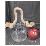 Clear glass lantern with rustic rope.