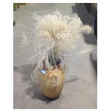 Dried ornamental grass in earthenware jar.