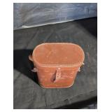 Binoculars in brown leather case.