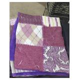 Purple patchwork handmade quilt.
