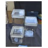 Trio of glass food canisters.