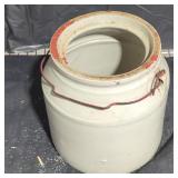 Stoneware jar with handle and no lid.