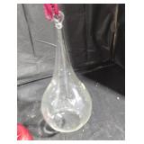 Clear tear drop glass terrarium.