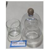 Glass cloche jar bell for displaying objects.