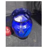 Blue glass vase with clear glass handles.