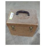 Vintage record holder with records inside.