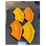 4 orange and yellow ceramic food trays.