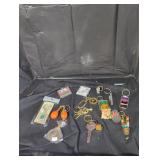 Vintage keychains and charms in ziplock bag lot.