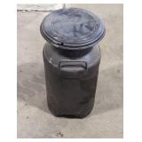 Vintage painted black steel milk can.