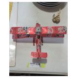 Handmade Coca-Cola biplane model.