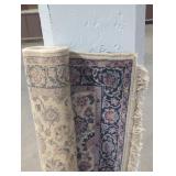 Rolled up 4 foot  area rug.