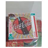 Coca-cola puzzles and flexible cutting mat.