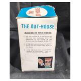 The outhouse figurine.