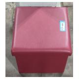 Small red "leather" ottoman.