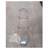 Vintage wall rack meant for decorative plates.