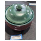 Vintage pottery casserole pot with wood.