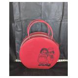 Raggedy and doll and case.