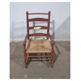 Small wooden rocking chair.
