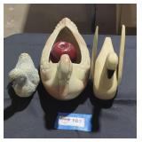 Duo of ducks and a wooden swan.