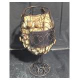 Corks in a metal wired wine decor.