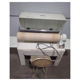 Maytag rotary ironer with chair.