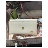 Purses in a briefcase lot.