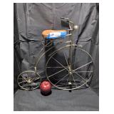 Vintage metal penny farthing bicycle sculpture.