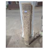 Rolled up 4 foot  area rug.