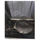 Cast iron skillet and cast iron cupcake tray.