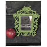 Vintage ornate green mirror.