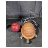 Vintage brass turtle base with amber glass shell.