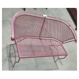 Maroon metal patio bench.