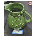 Green ceramic pitcher.
