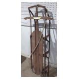Vintage lighting guider wooden snow sled.