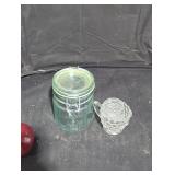 Vintage green glass hermetic storage jar .