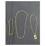 Trio of costume jewelry necklaces lot.