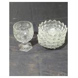 4 cut edge glass candle holders and a cut edge