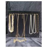 Costume jewelry necklaces lot with 14k necklace.