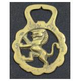 Brass door knocker with animal design.