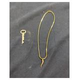 Costume jewelry necklace and old key