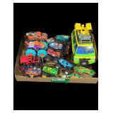 Toy monster trucks and more box lot.