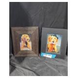 Pair of framed dog photos.