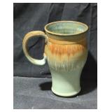 Glazed Ceramic Mug with Earthy Tones