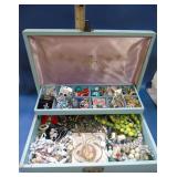 large blue jewelry box with jewelry
