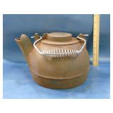 old cast iron tea kettle with swivel lid
