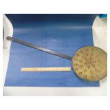 copper/brass skimmer or fireplace tool