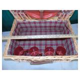 nice wicker picnic basket with supplies for 4
