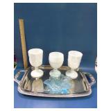 Milk glass and blue glass on tray