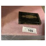 VINTAGE TIN J.H. BASSETT ADDER, A TYPE  OF